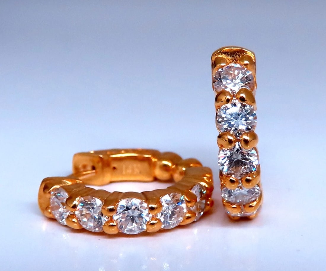 1.50ct Natural Round Diamond mini hoop earrings 14kt yellow gold Dime: Dime-sized natural diamond hoop earrings. 1.50ct. round brilliant diamonds G color vs2 clarity 14 karat yellow gold 5.4 grams 16 mm wide front to back 3.3 mm thick at Diamond row Push button