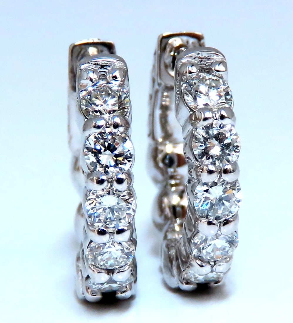 .83ct Natural Round Diamond hoop earrings 14kt 15mm single share prong: Dime sized natural diamond hoop earrings. Single sharing prong design .83 carat round brilliant diamonds G color vs2 clarity 14 karat white gold 4.9 g 15 mm wide front to back 3 mm thick at Diamond