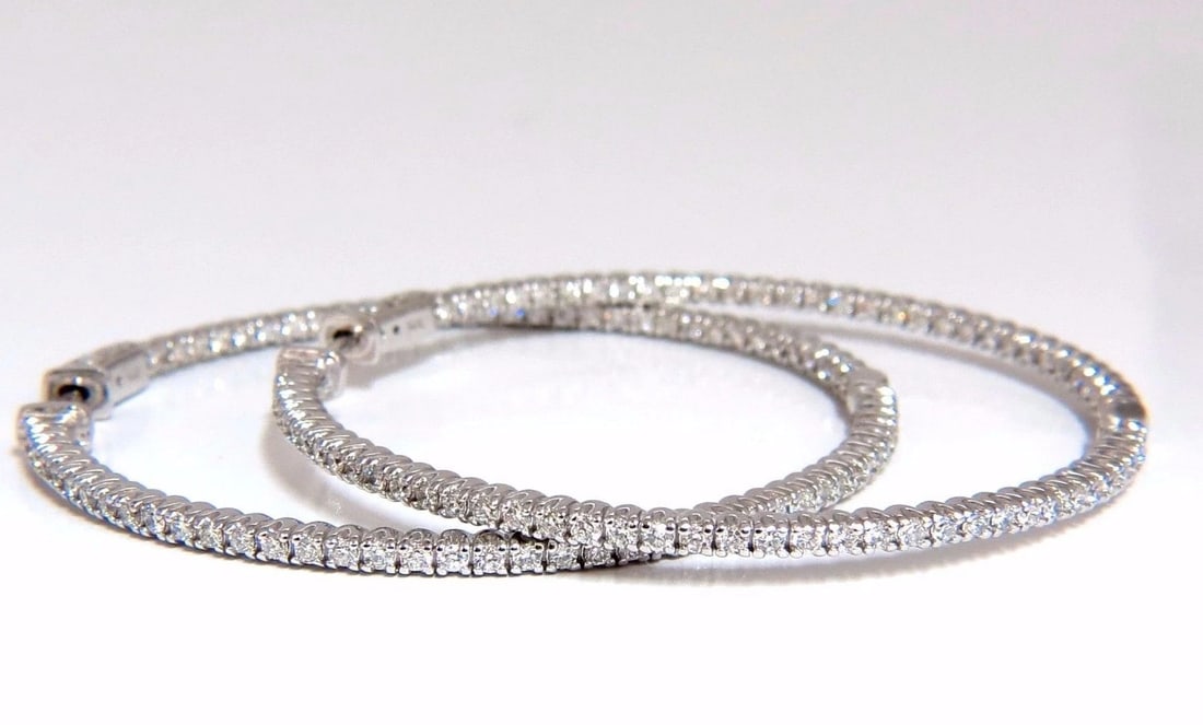 1.77ct natural round brilliant in/out diamond hoop earrings 14kt g/vs: Modern, In & Out. 1.77ct. Natural Round, Brilliant diamonds hoop earrings. inside / out G color, VS-2 clarity Full cuts, great sparkle. 1.92 inch in diameter 1.9 mm wide 12 grams. 14kt. white gold. Bu