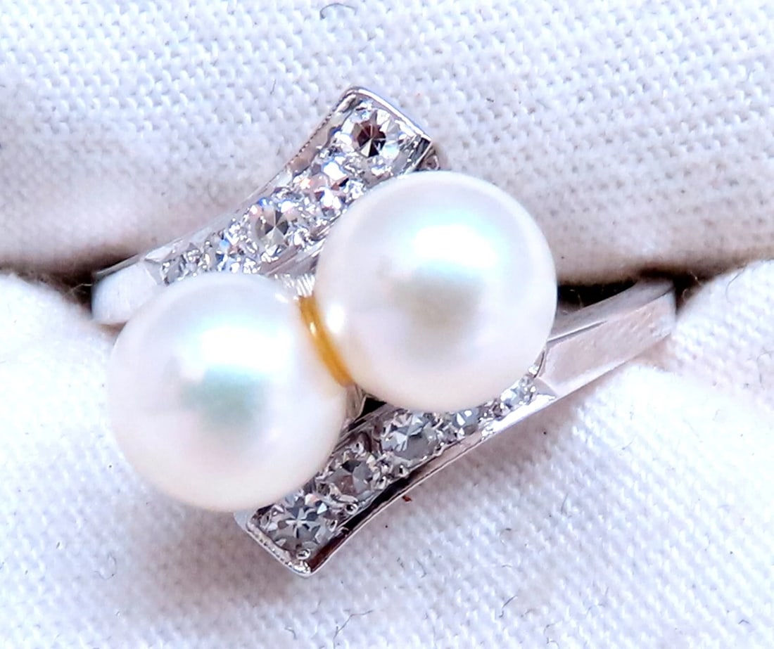 6.5mm Natural White Cultured Pearl Diamonds Rings 14kt: 6.5mm Natural Fresh water pearl Gold Ring .25ct Natural Round Diamonds 14kt. white gold 4.3 grams. Current ring size: 5.25 We may resize. Depth of ring: 9.6mm All Items come with a Free White ribbon
