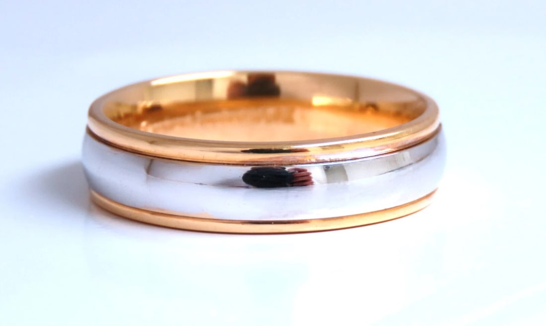 Two Toned Unisex Gold Band 14kt gold Size 10 5.8mm: Classic Two Toned Gold band. High Shine Finish 5.8mm wide 2 mm depth 14 karat yellow gold 7.8 grams Size 10 ....*. Reserve: $1,104.00 Shipping: Domestic: Free shipping to anywhere within the