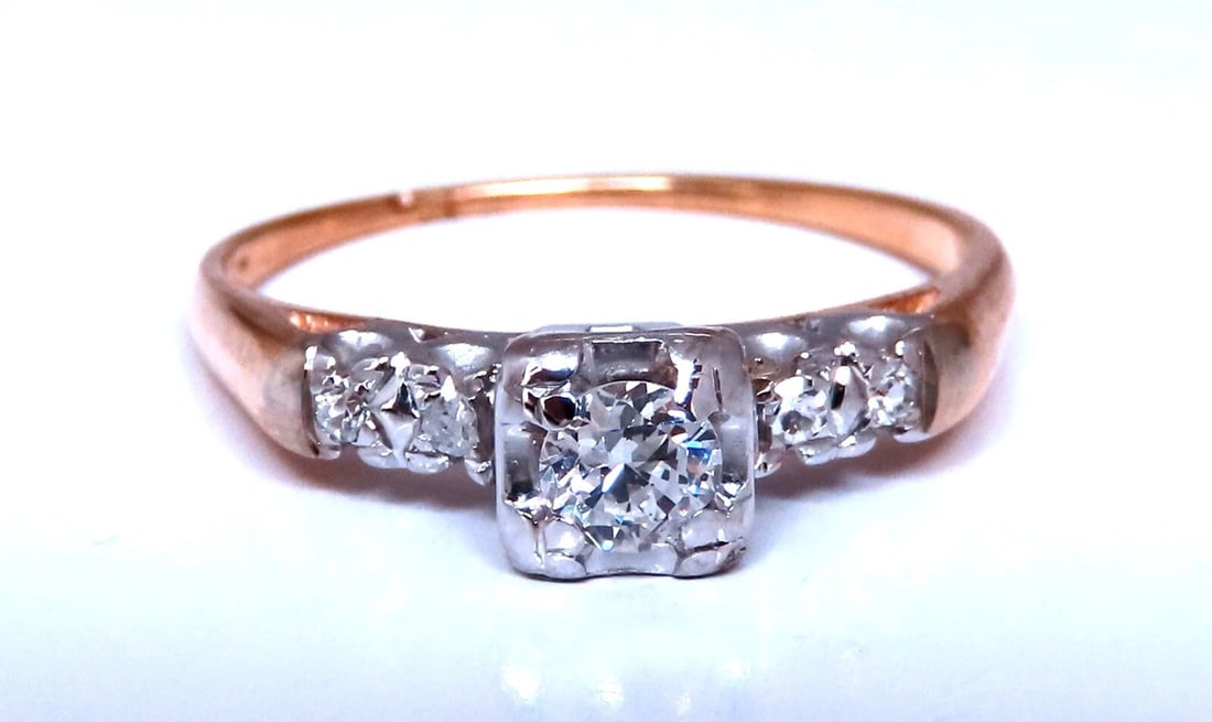 Vintage Natural Diamond Engagement ring .40ct 14kt Gold: .40ct Natural round Cut Diamond Ring vs-2 clarity G color. .10ct side diamonds Si-1 clarity I-color 14kt yellow gold 2.5 Grams Depth: 6mm Current ring size: 9.5 May professionally resize, please inqui