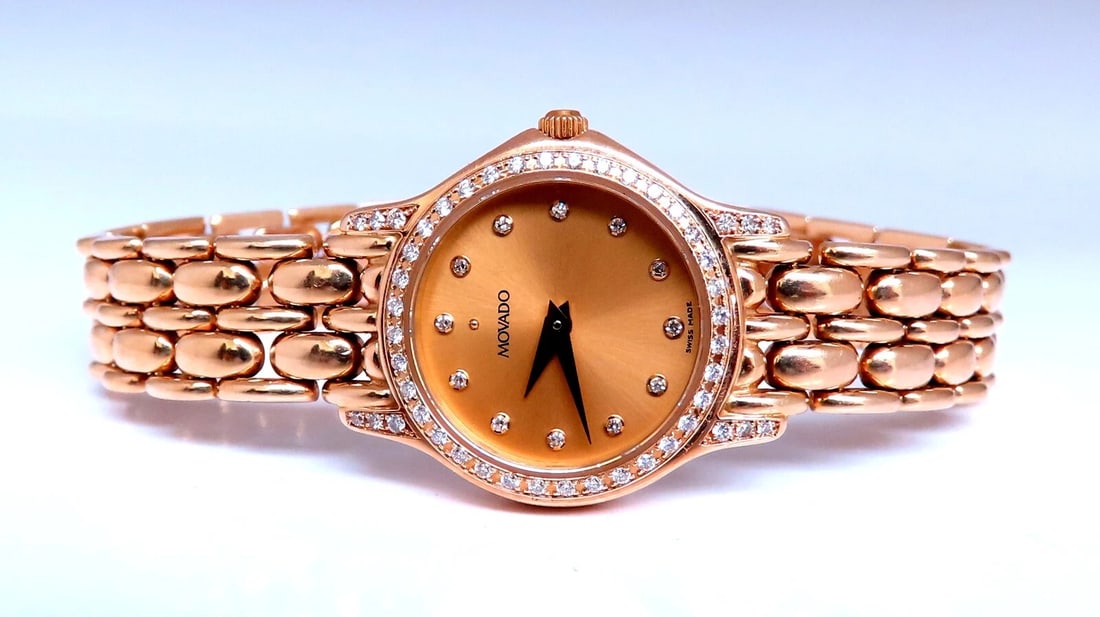 Movado Watch 14kt Gold: Movado Ladies Gold watch Excellent condition. Made for 7-in wrist. .285 carat natural diamonds rounds full cuts G color VS2 clarity. 37 grams Tested working order. Battery, Swiss quartz