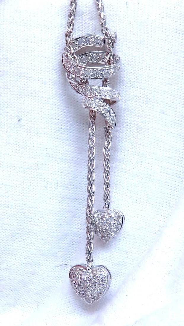 .90ct Natural Diamonds Dangle Hearts & Spiral Statement Necklace 18kt Gold: .90ct natural round diamond hearts necklace Double dangle hearts G color vs2 clarity Dangle: 2 inches 17 inches long 8.4 grams ....*. Reserve: $2,300.00 Shipping: Domestic: Free shipping to anywhere