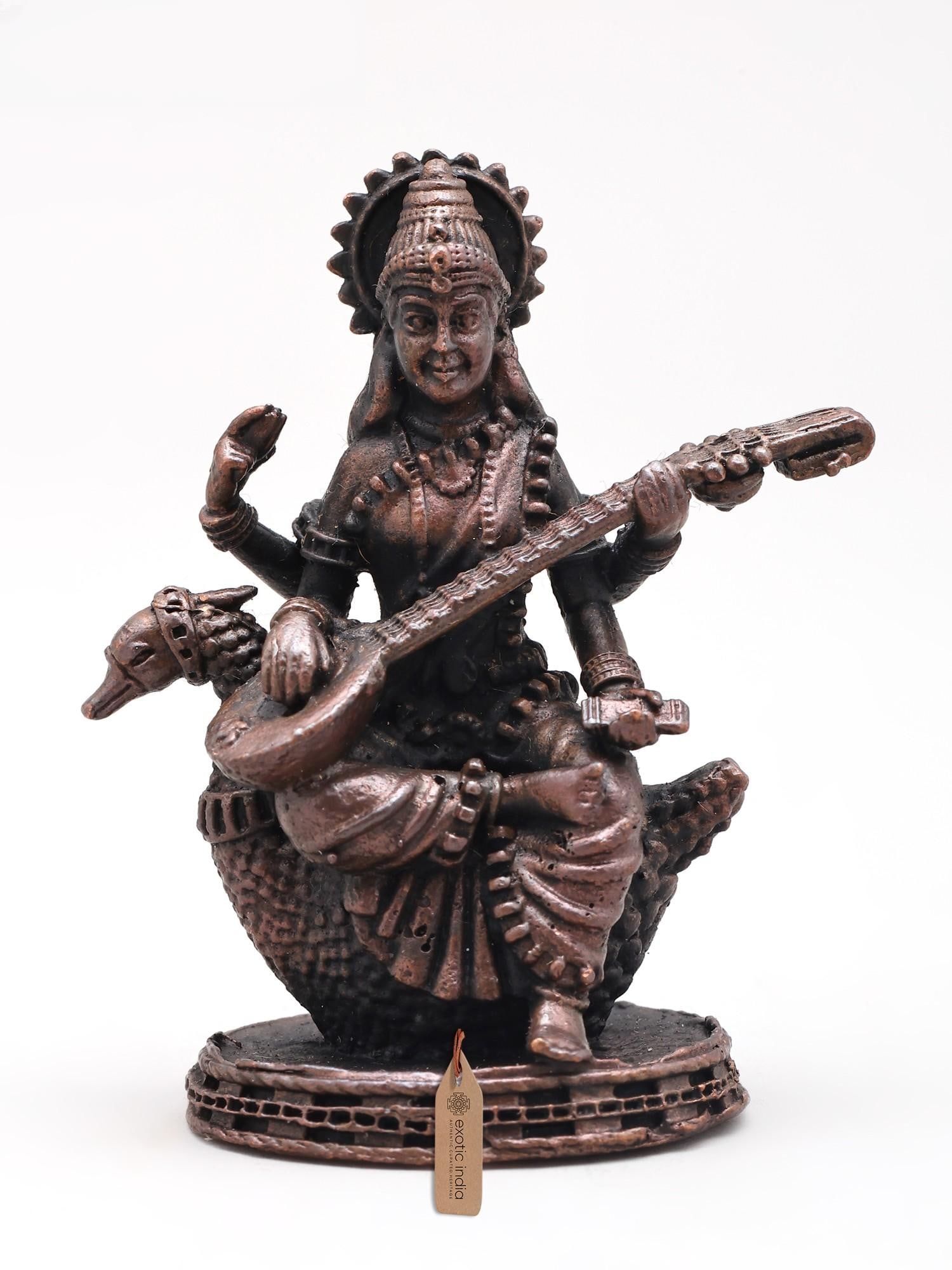 2" Small Devi Maa Saraswati Seated on Swan | Copper Statue: Description: 2" Small Devi Maa Saraswati Seated on Swan | Copper Statue
