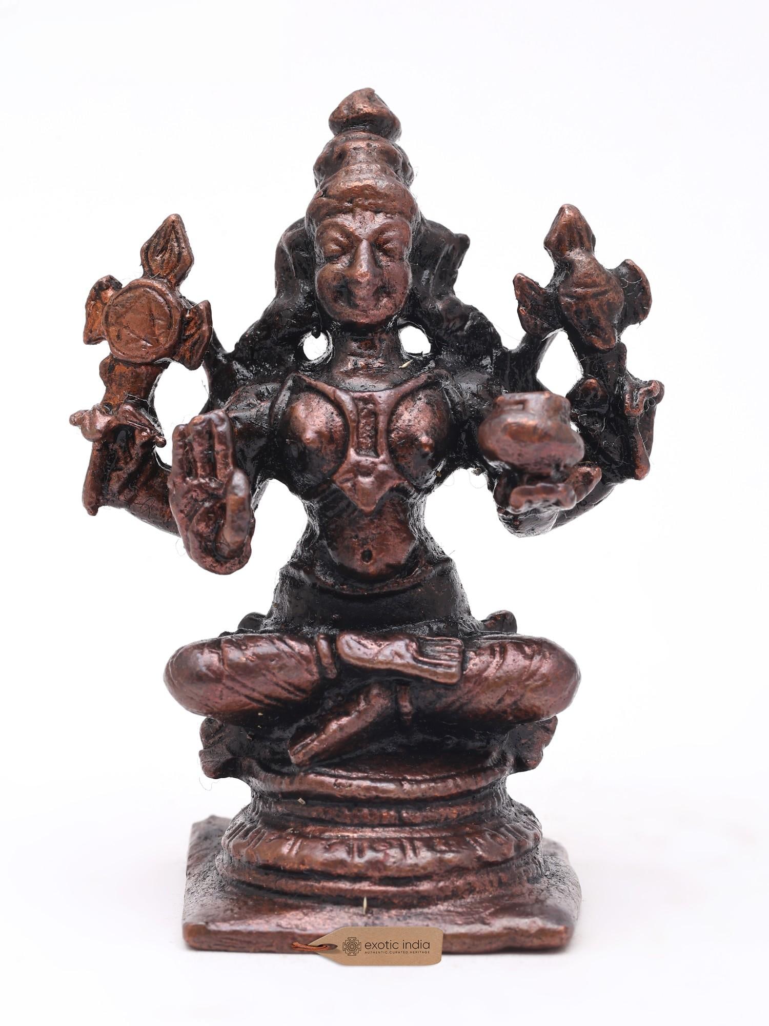 Small Four Armed Lord Dhanvantari Seated on Pedestal | Copper Statue | Made in India: Description: Small Four Armed Lord Dhanvantari Seated on Pedestal | Copper Statue | Made in India