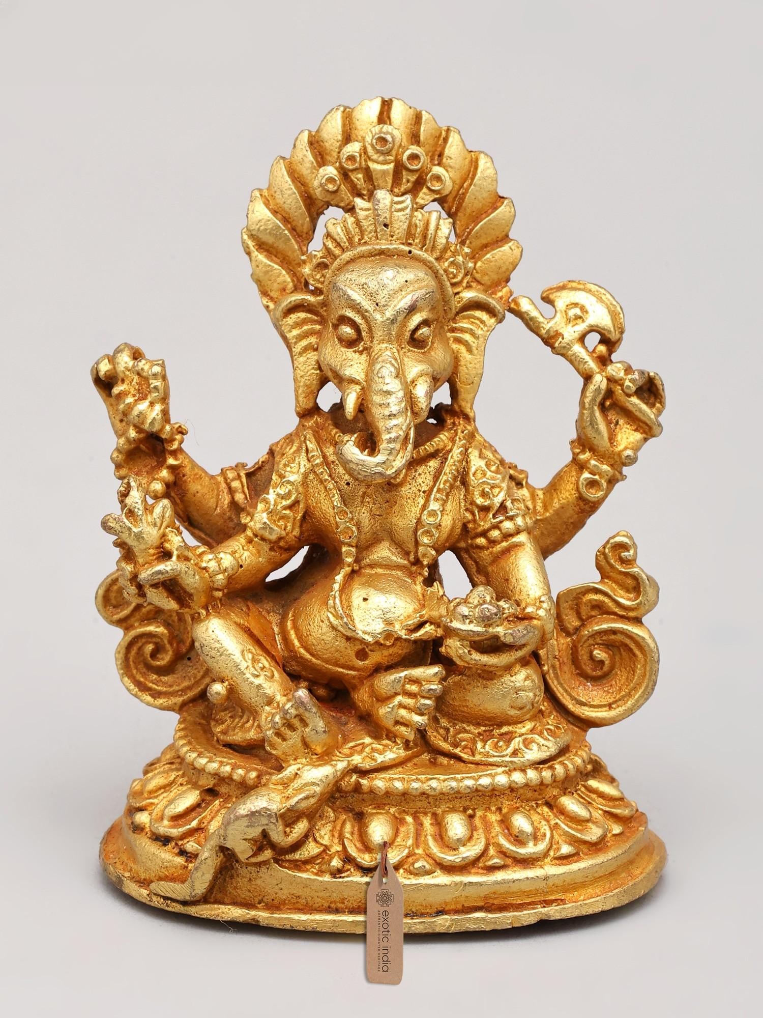 1" Small Four Armed Nepali Ganesha | Copper Statue Gilded with 24 Karat Gold: Description: 1" Small Four Armed Nepali Ganesha | Copper Statue Gilded with 24 Karat Gold