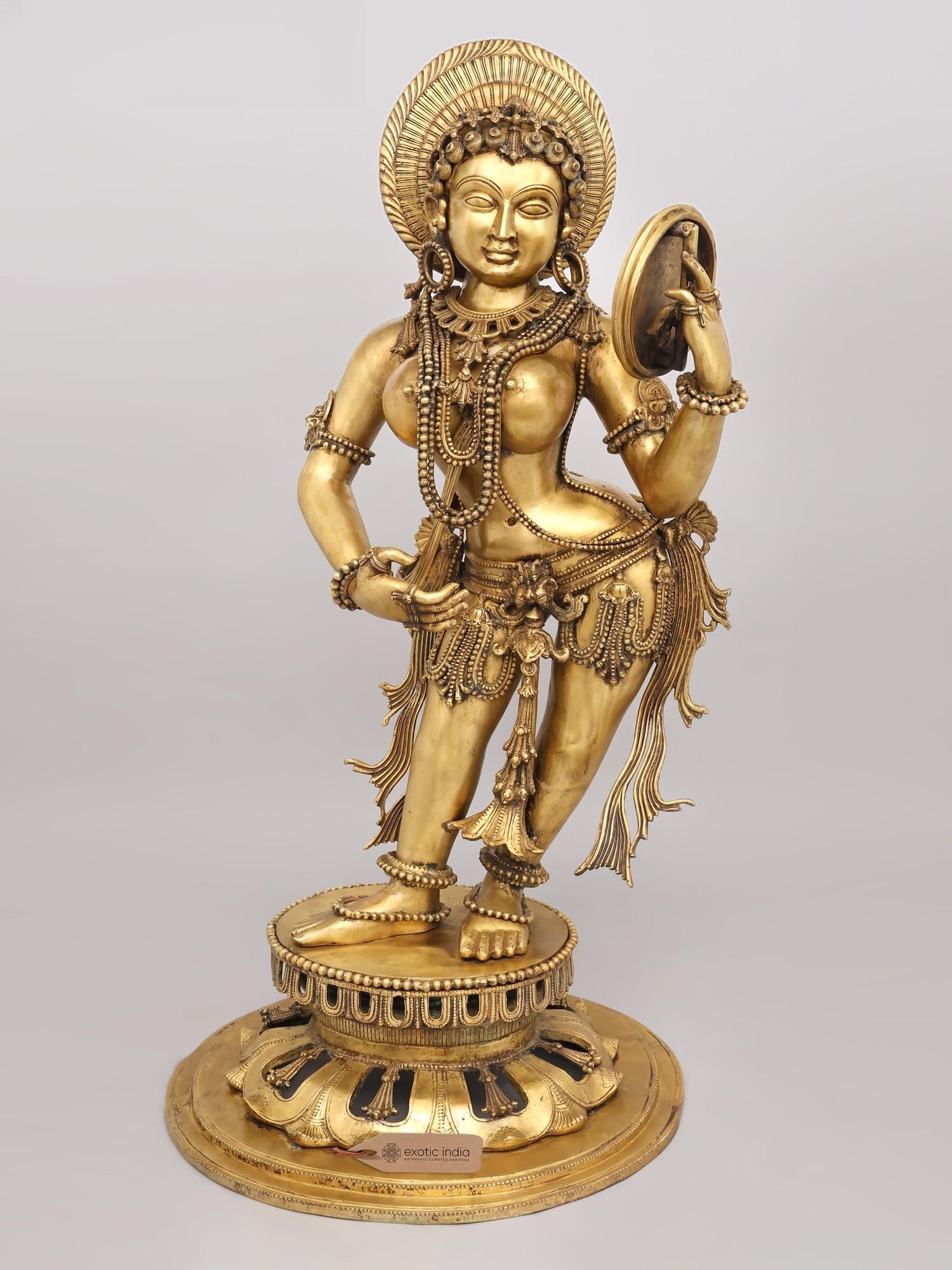 Darpana Sundari (Mirror Lady) | Hoysala Bronze: Description: This Darapana Sundari (mirror lady) stands as a contemporary homage to the highest refinement of the Hoysala aesthetic vision, developed around the 12th century. In the Hoysala