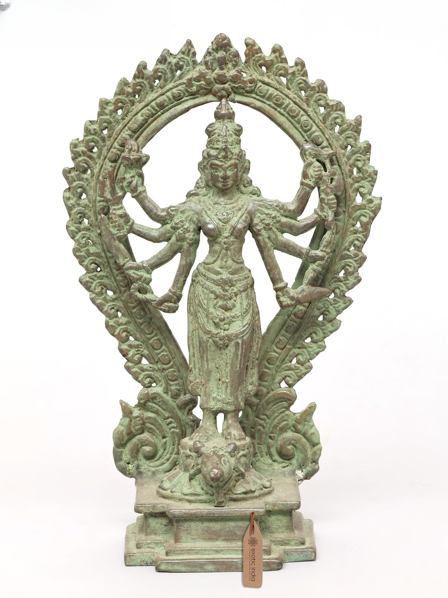 10" Eight Armed Standing Goddess Durga with Ornate Prabhavali | Brass Statue: Description: 10" Eight Armed Standing Goddess Durga with Ornate Prabhavali | Brass Statue