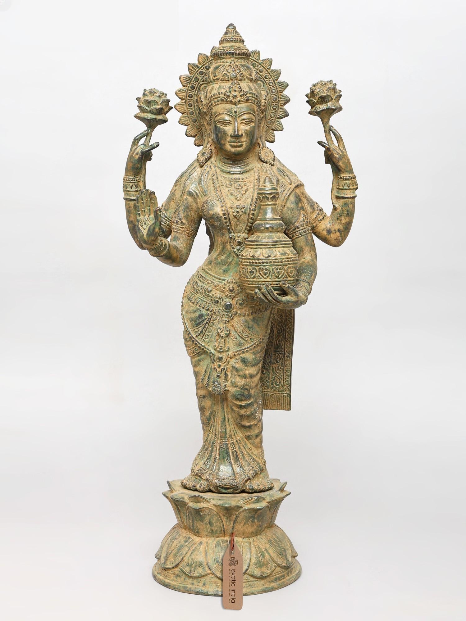 27" Standing Goddess Lakshmi with Wealth Pot | Brass Statue: Description: 27" Standing Goddess Lakshmi with Wealth Pot | Brass Statue