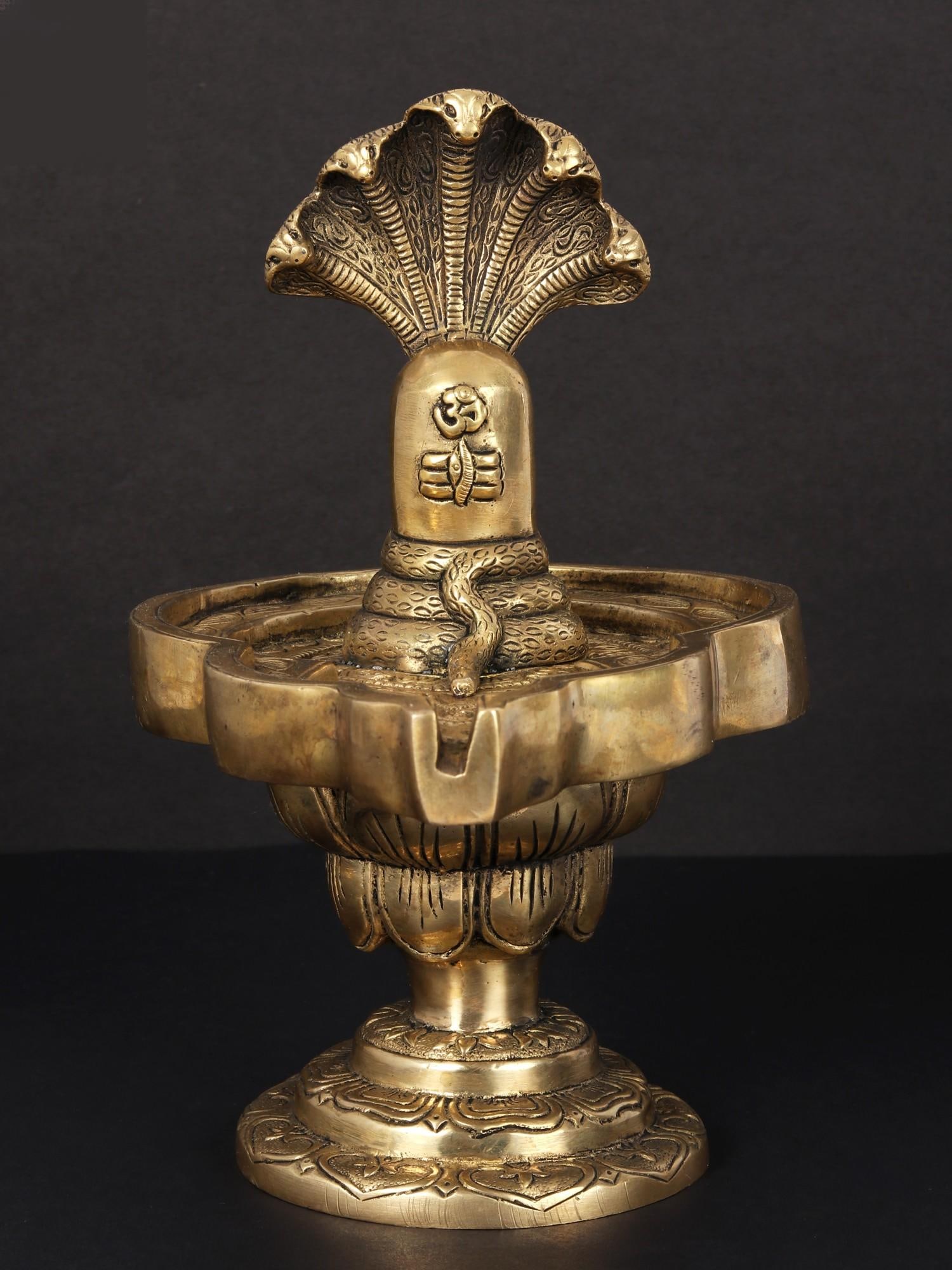 9" Shivalinga Idol on Lotus Pedestal in Brass | Handmade | Made in India: Description: See It In Your Home Purity and beauty can come from adversity, just as the lotus that blooms in murky waters. This sculpture depicts the Shivalinga on a lotus pedestal in glittering brass