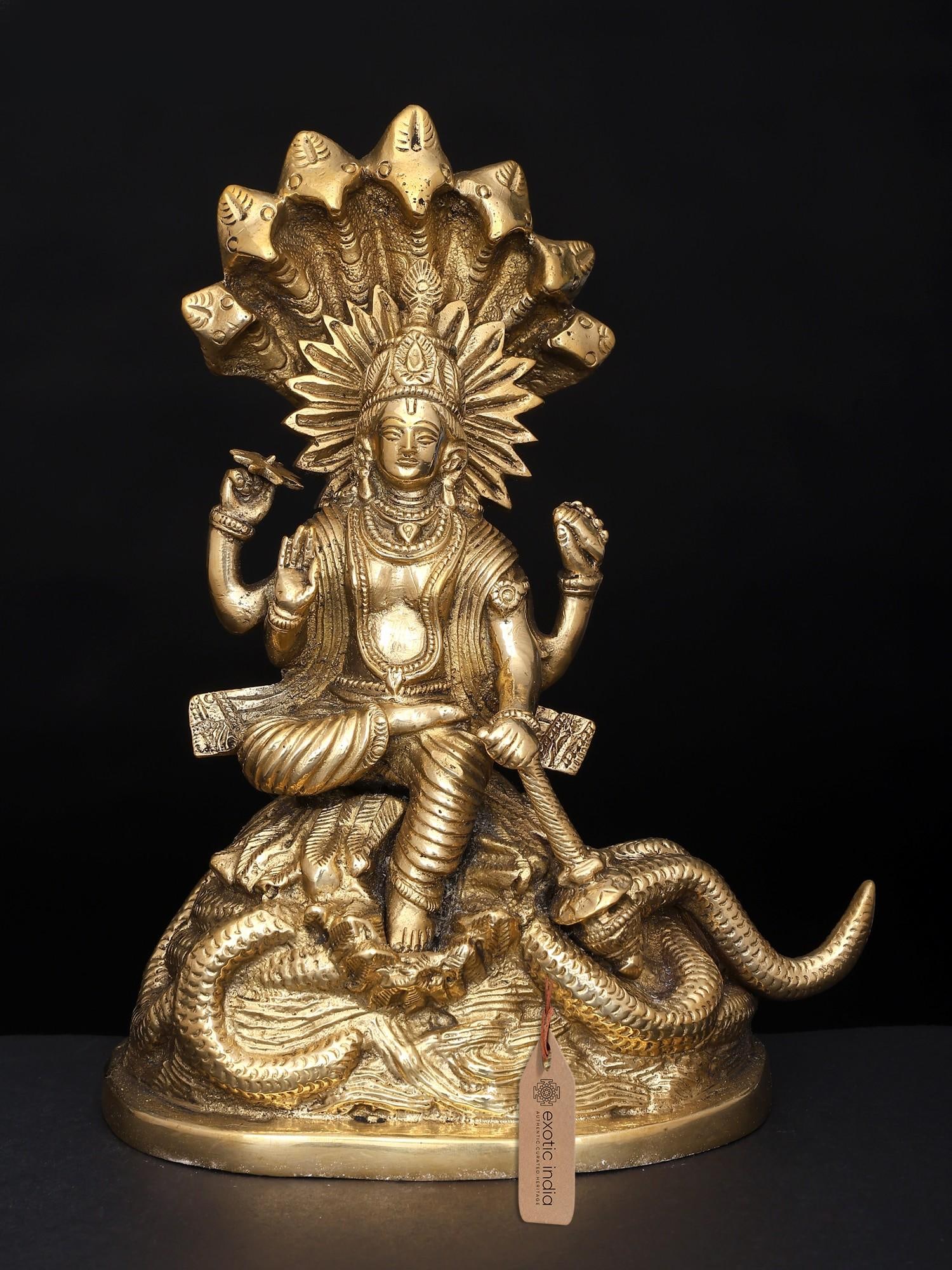 8" Brass Lord Vishnu Statue on Sheshanaga: Description: See It In Your Home Majestically seated on the coils of the Adi-Shesha, which are dynamically presented as if floating in the waves of Kshirasagar, Lord Vishnu in this brass statue appear