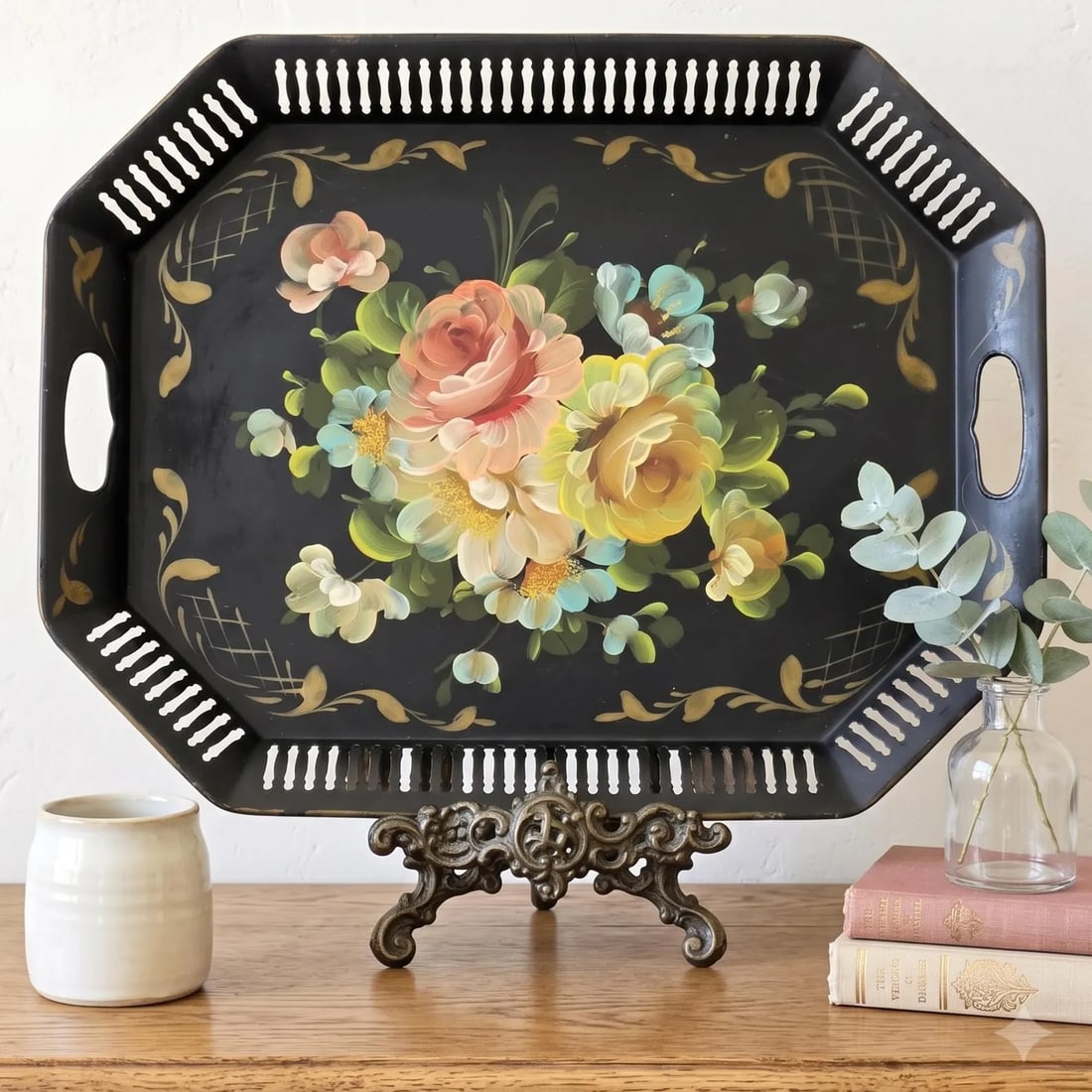 Hand Painted Black Floral Tray Vanity Serving Toleware Coffee Table Entryway Decor: A vintage hand-painted toleware serving tray with a soft, muted floral bouquet on black and a pierced gallery rim — a mid-century American tole piece built for serving and display alike. THE PIE