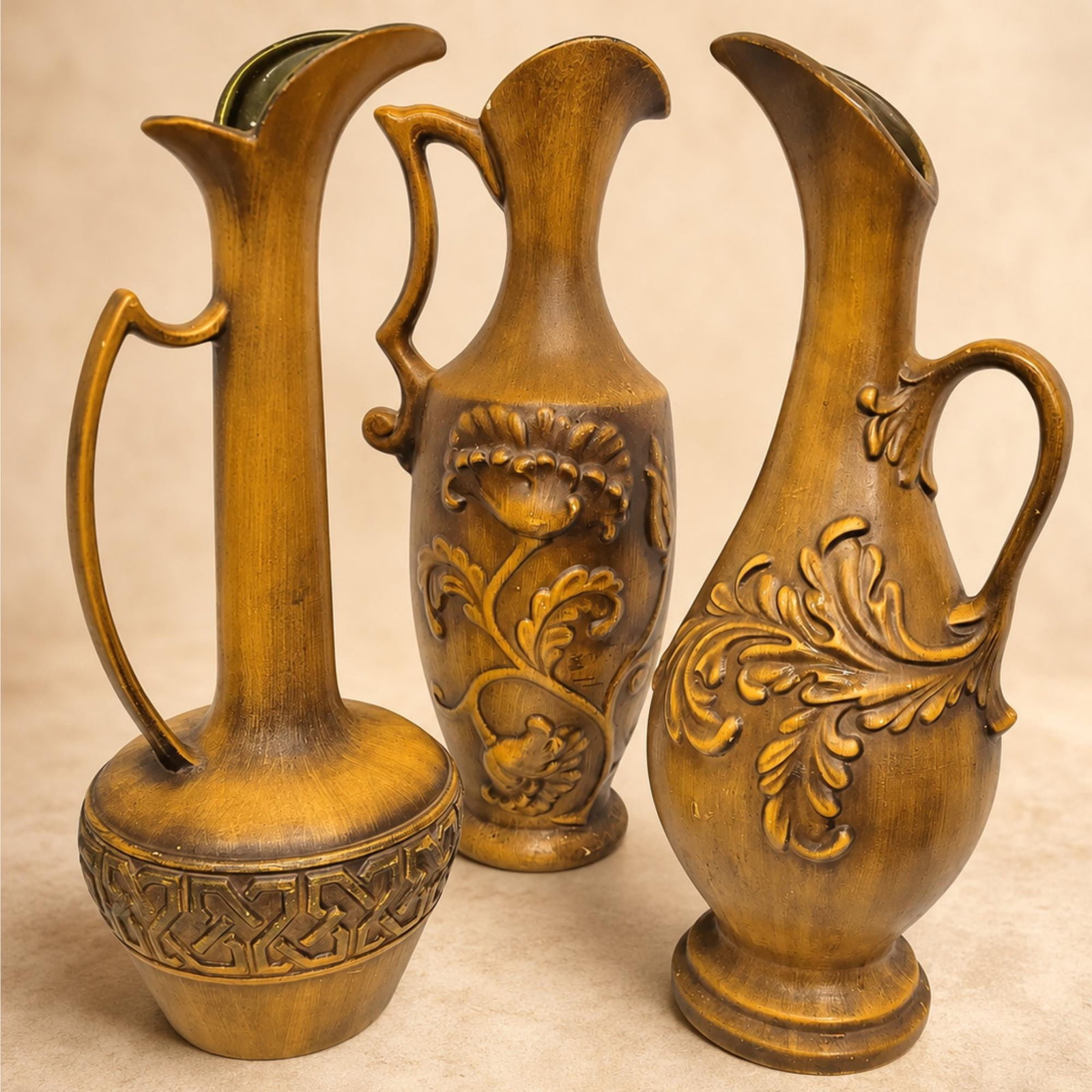 Set of 3 Royal Haeger Ewer Vases, Gold Ceramic Pottery Pitcher Set, Mid Century Old World Mantel: Set of three vintage Royal Haeger ewer vases in warm antique gold — collectible mid-century American art pottery, tall and sculptural for a mantel or console. Add a dramatic splash of Hollywood 