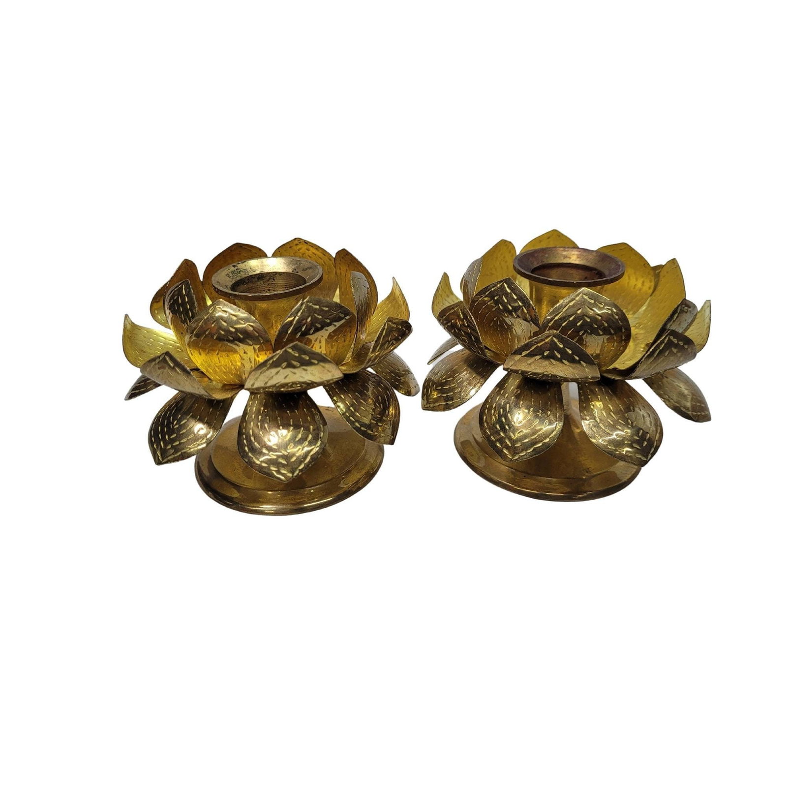 1970 Brass Lotus Candle Holders Pair Mid Century Brutalist Metal Flowers Hollywood Regency: A pair of Mid-Century Modern brass lotus flower candle holders, designed in the iconic style of Tommi Parzinger. Boasting a striking Hollywood Regency flair, these vintage 1970s reproductions feature 