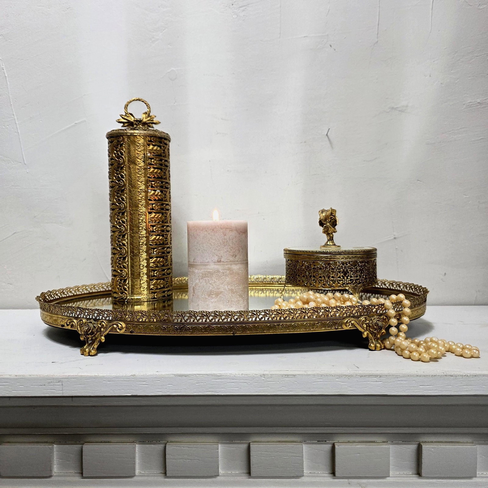 1960's Stylebuilt Vanity Mirror Tray Set Victorian Gothic Gilded Gold Accents: 1960 Stylebuilt, made when American craftsmen still hand-filigreed 24K gold onto solid metal. The Mirrored Tray has 4 feet that holds the oval mirror and also provides a riser look to hold accessories