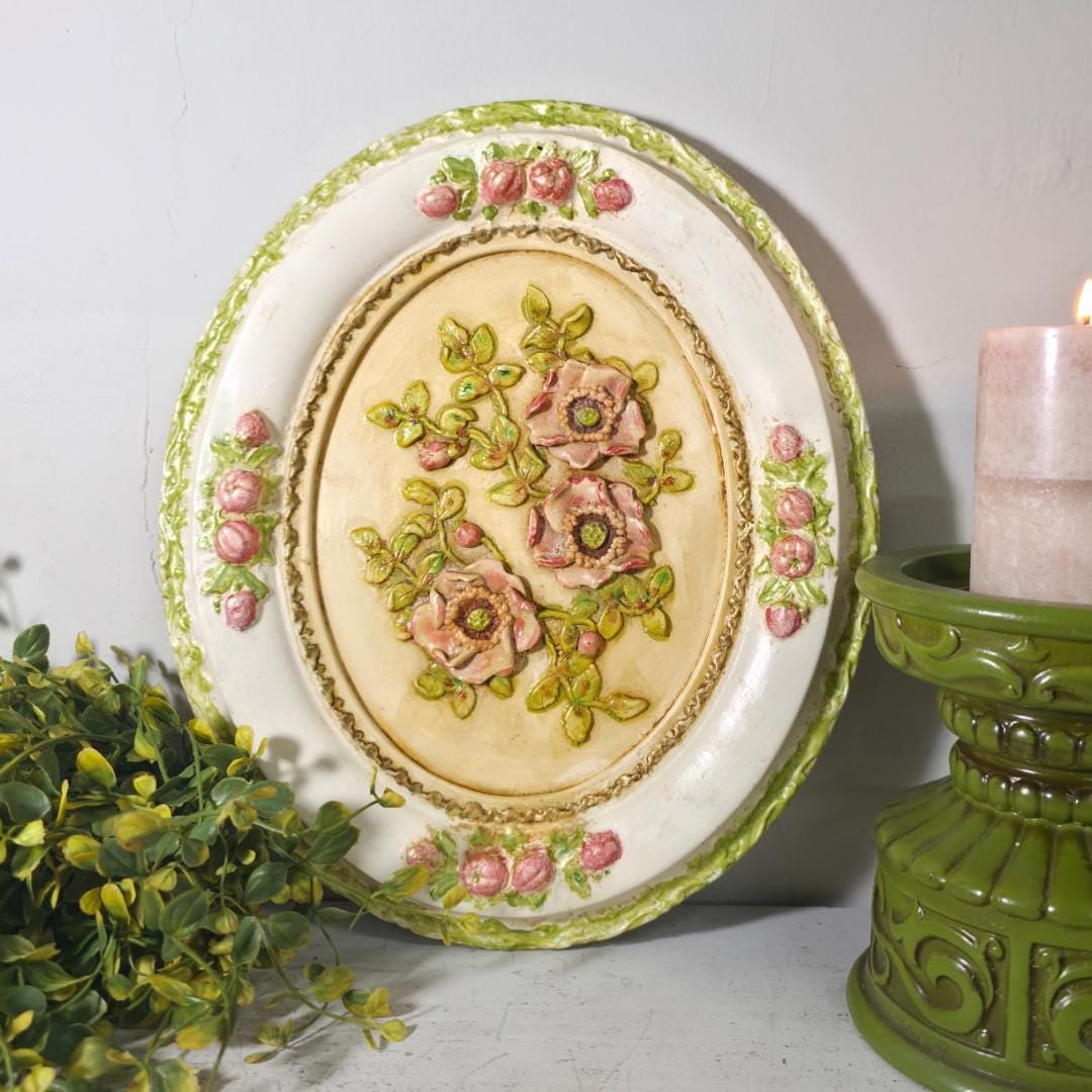 Chalkware Floral Wall Plaque, Oval Raised Relief Pink Roses Cottage: Soft, dimensional, and quietly charming — the kind of piece that earns its place on a gallery wall and stays there for decades. DETAILS AT A GLANCE Size: 13"H × 11"W × 1" deep