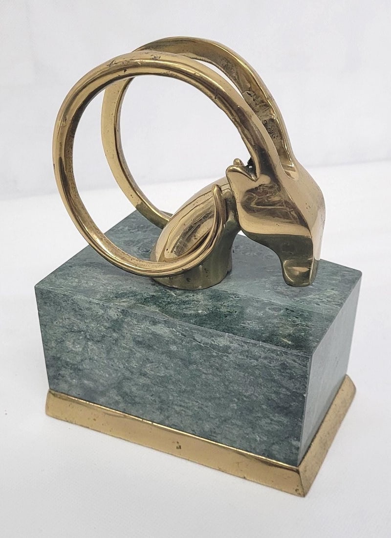 Vintage Brass Ram Head Sculpture, Green Marble Base Hollywood Regency Decor: Striking brass ram’s head sculpture featuring bold, looping horns and a polished finish, mounted on a solid green marble stone base. Sculptural and graphic, this piece works beautifully as a dec