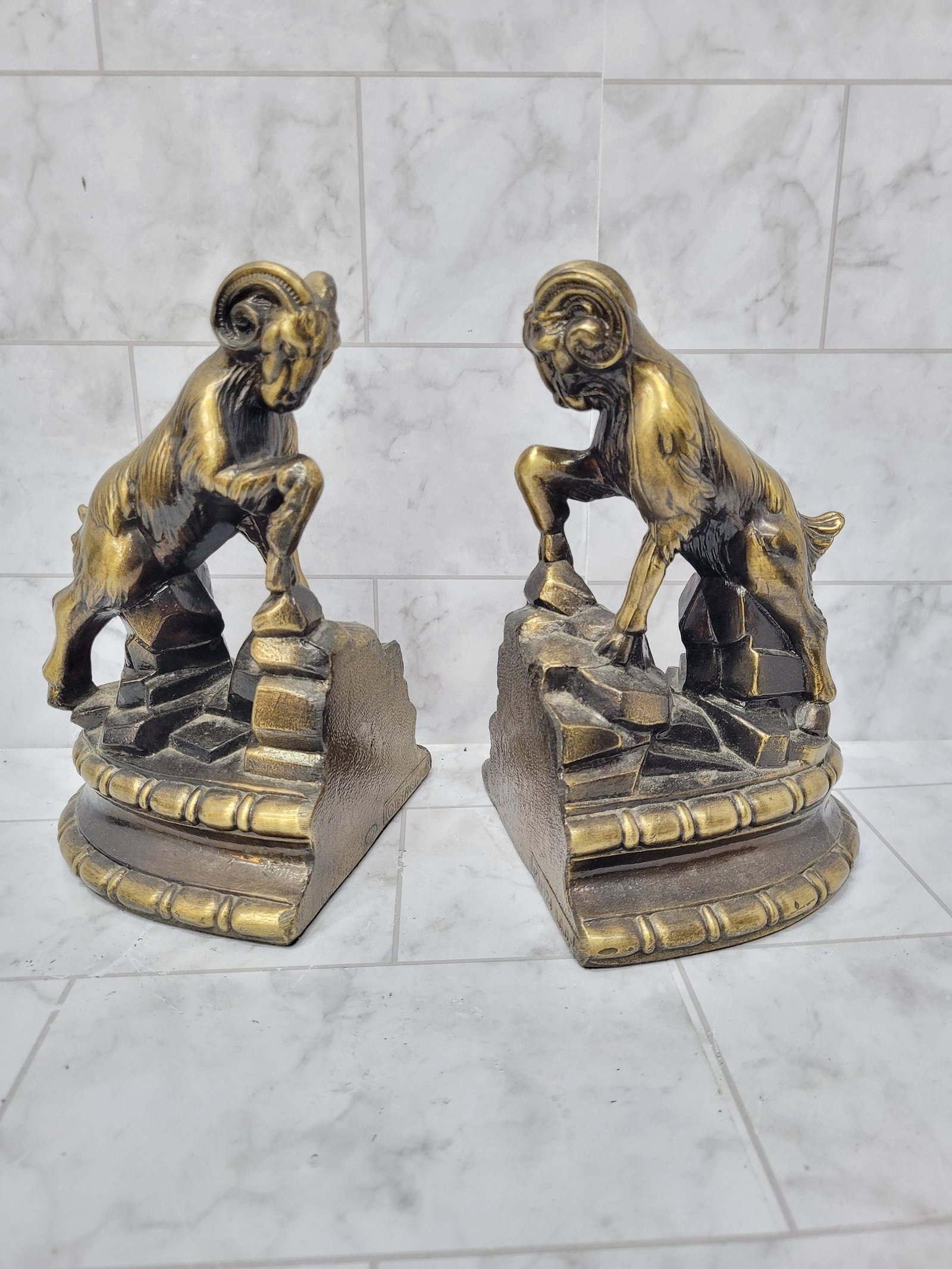 1974 Gold Ram Bookends 1974 Metal Gilt Pair Hollywood Regency Library Office Decor Aries Park: Bold, sculptural vintage ram bookends by Park Sherman with a copyright date of 1974—a classic animalier look made for bookshelves, studies, and masculine interiors. The stepped base + stylized r