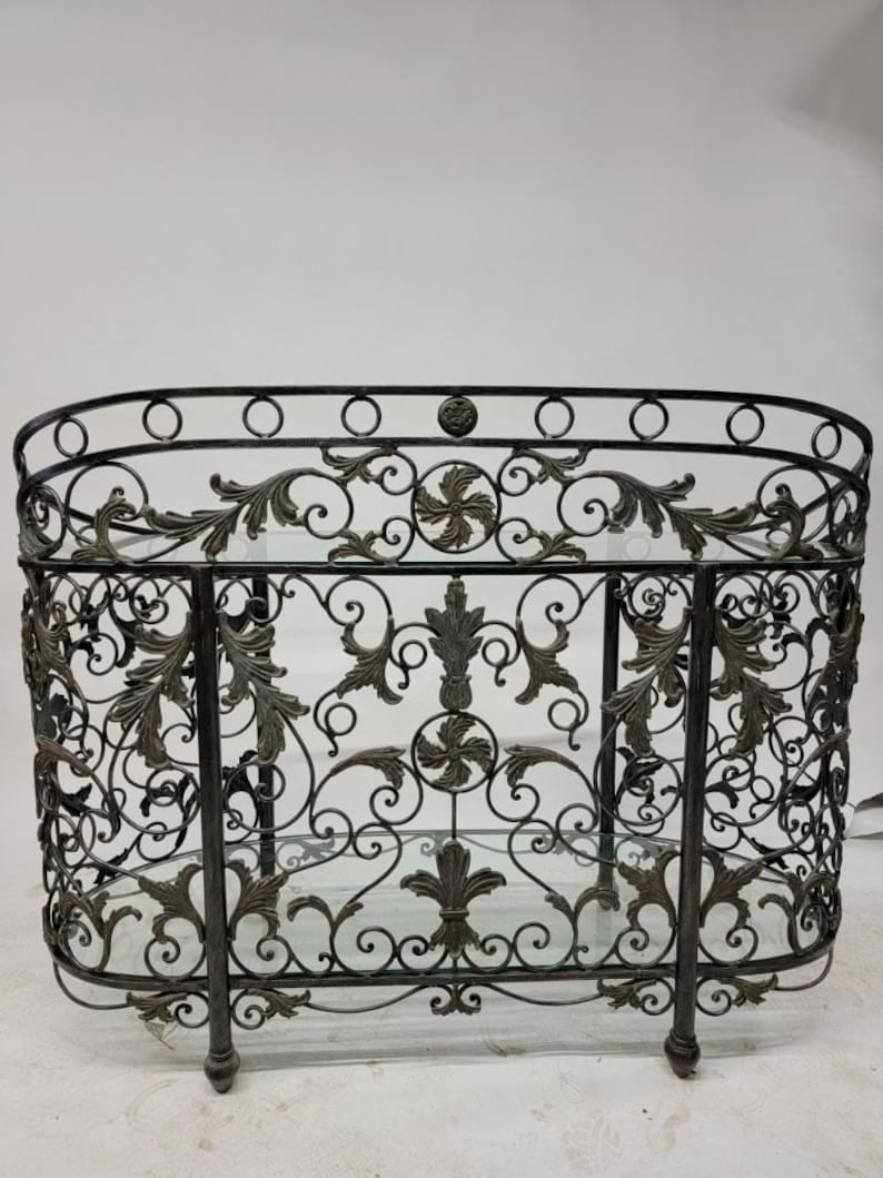 Vintage Maitland Smith Wrought Iron Oval Console Table: Vintage Maitland Smith Wrought Forged Iron Oval Glass Top Sideboard/Console Table Gorgeous Black Ornate Wrought-Iron Forged Scrolled Foliage Motif with Thick Inlaid Glass Top and Bottom Glass Shelf. S