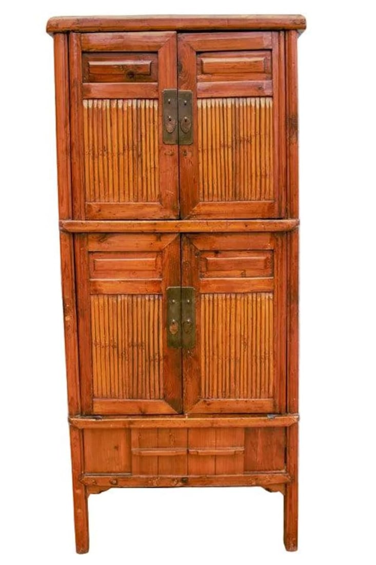 Antique Chinese Qing Dynasty Style Cabinet: Antique Chinese Qing Dynasty Style Cabinet with Bamboo and Sliding Panels This antique Chinese Qing Dynasty period cabinet features a flaring silhouette showcasing two pairs of double doors opening