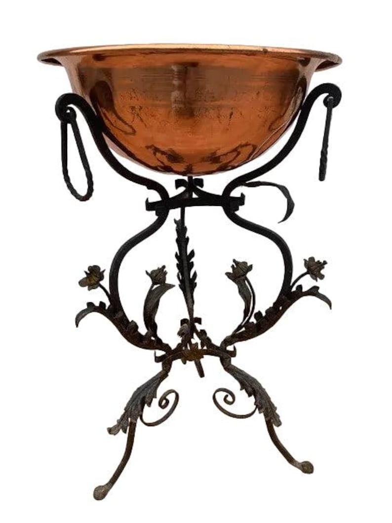 Antique Wrought Iron and Copper Planter: Antique Floral Accent Planter Wrought Iron and Copper Planter - 2 Piece Set This is a gorgeous antique planter's base is solid iron worked into a lovely design. This piece would be an absolutely stunn