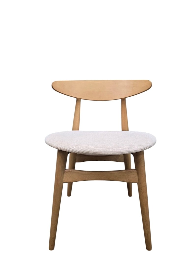MCM Beachwood Hans Wegner Style Chair: Mid Century Modern Beachwood Hans Wegner Style Chair Mid-century modern beechwood chair in the style of Hans Wegner, featuring softly rounded legs and a curved backrest. Clean, sculptural, and