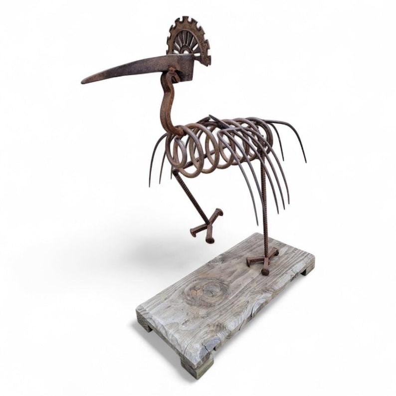 Vintage Hand Forged Peacock Garden Folk Art Statue: Vintage Hand Forged Peacock Garden Folk Art Statue on Wood Base This vintage hand-forged peacock garden folk art statue is a stunning addition to any outdoor space. The statue showcases the intricate 