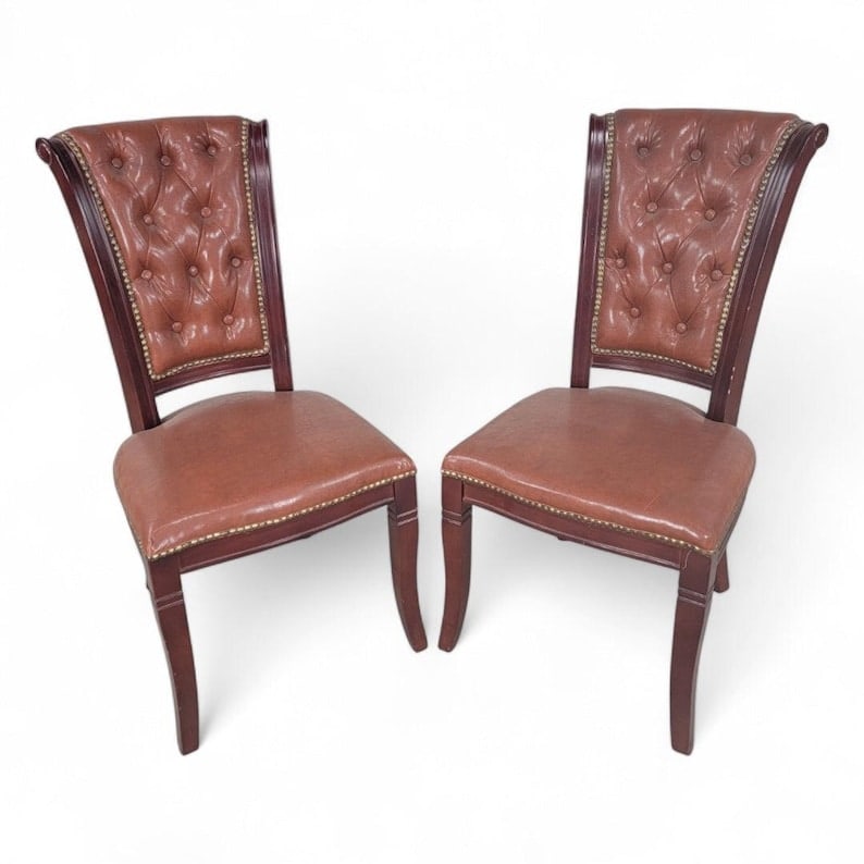 Vintage Italian Mahogany Scroll Back Tufted Leather Side Chairs with Nailhead Trim, Pair: Vintage Italian set of 2 Classic Mahogany Scroll Back Tufted Leather Side Chairs with Antique Gold Nailhead Trim - Pair Circa Late 20th Century Dimensions: 39.5"H x 19.5"W x 24"D Seat: 18.2"H x