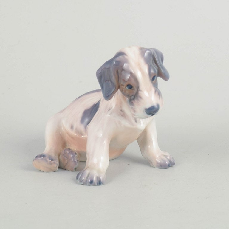 Dahl Jensen, Denmark. Porcelain dog figurine in muted tones with brown-grey accents. Approx. 1930s. (1 of 4)