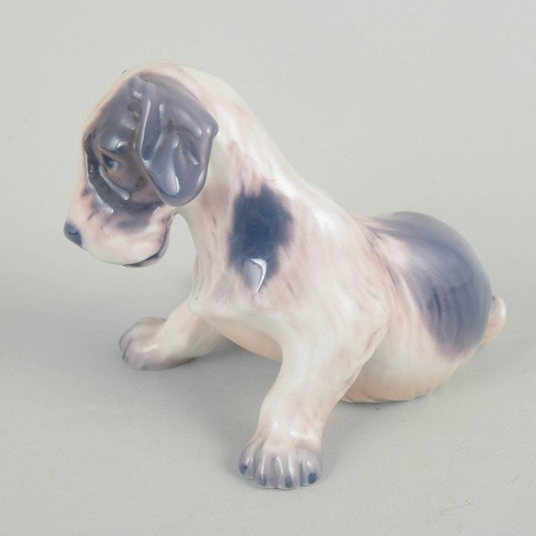 Dahl Jensen, Denmark. Porcelain dog figurine in muted tones with brown-grey accents. Approx. 1930s. - 3