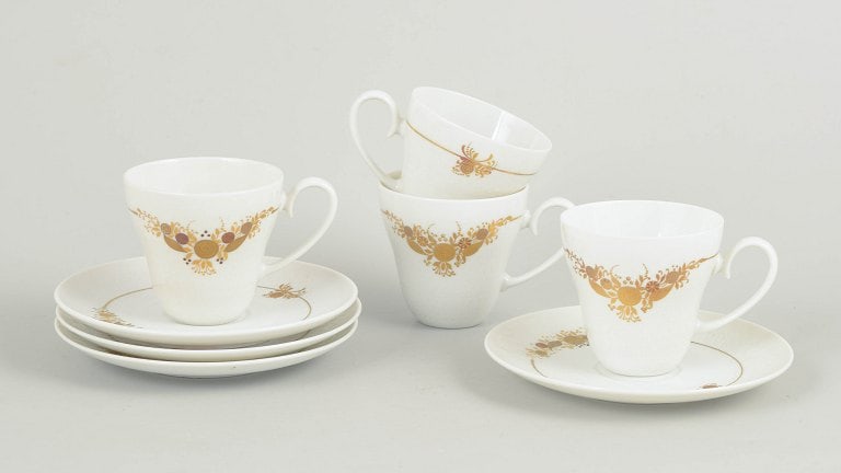 Bjørn Wiinblad for Rosenthal, Germany. Set of four porcelain coffee cups with matching saucers: Bjørn Wiinblad for Rosenthal, set of four coffee cups with matching saucers. Set consisting of four coffee cups with matching saucers in porcelain decorated with the characteristic floral ornamen