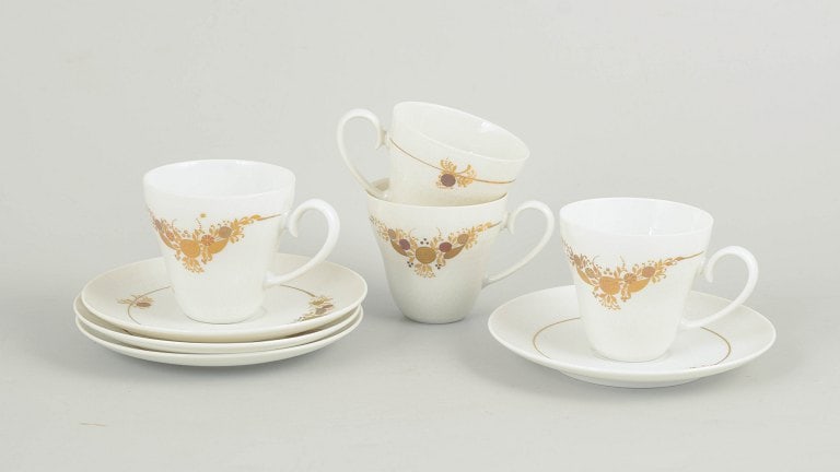Bjørn Wiinblad for Rosenthal, Germany. Set of four porcelain coffee cups with matching saucers: Bjørn Wiinblad for Rosenthal, set of four coffee cups with matching saucers. Set consisting of four coffee cups with matching saucers in porcelain decorated with the characteristic floral ornamen