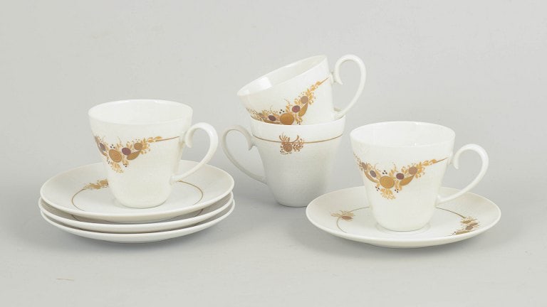 Bjørn Wiinblad for Rosenthal, Germany. Set of four porcelain coffee cups with matching saucers: Bjørn Wiinblad for Rosenthal, set of four coffee cups with matching saucers. Set consisting of four coffee cups with matching saucers in porcelain decorated with the characteristic floral ornamen
