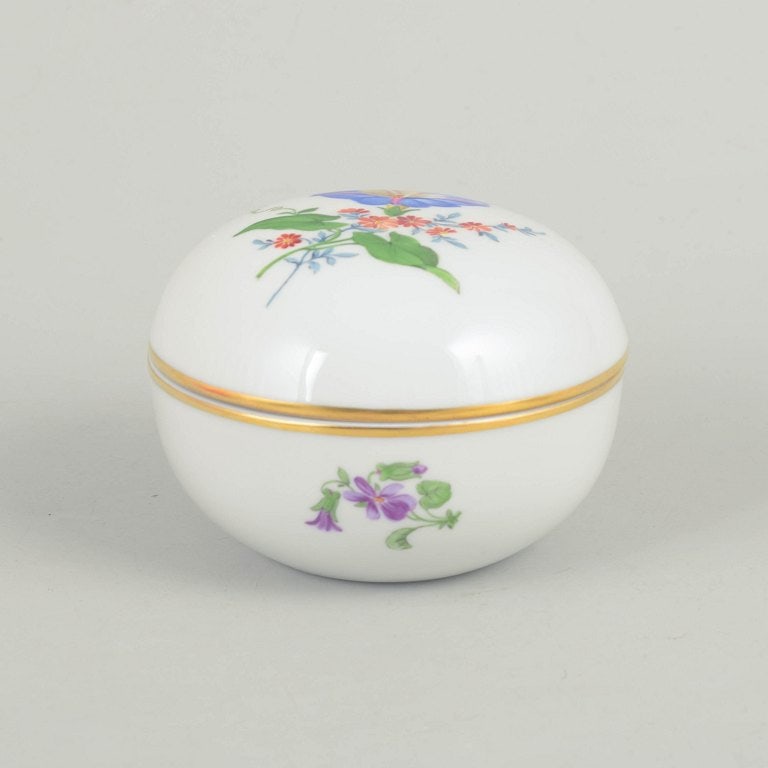 Meissen, Germany. Porcelain lidded jar with polychrome flower decoration. Mid-20th century. (1 of 4)