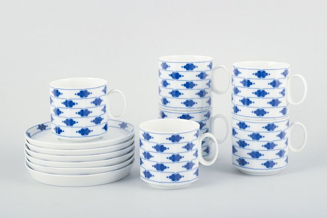 Tapio Wirkkala for Rosenthal Studio-linie, Germany. Six pairs of porcelain coffee cups with saucers: Rosenthal Studio-linie, six pairs of coffee cups with saucers and a cream jug, Corinth Blue pattern, design by Tapio Wirkkala. A set consisting of six coffee cups with matching saucers and a cream jug