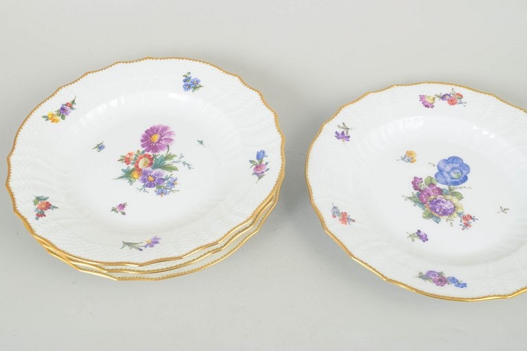 Royal Copenhagen, Denmark. Saxon flower, set of four porcelain dinner plates with floral motifs and - 2