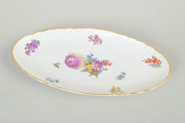Royal Copenhagen, Denmark. Saxon flower, oval dish with floral motifs and a gilded rim. Approx. - 2