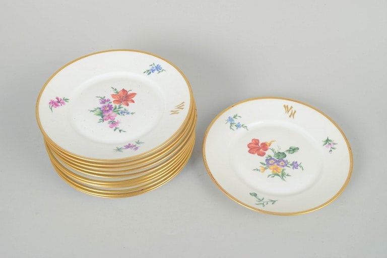 Rosenthal, Germany. Porcelain set of twelve plates with polychrome floral decoration and gilded rim. - 2