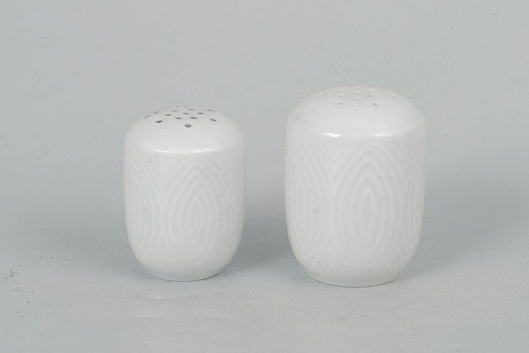 Axel Salto for Royal Copenhagen, Denmark. Porcelain salt and pepper set with relief decoration.: Axel Salto for Royal Copenhagen, salt and pepper set. Elegant porcelain salt and pepper set with refined relief decoration and organic forms, produced for Royal Copenhagen. The set reflects Axel Salto