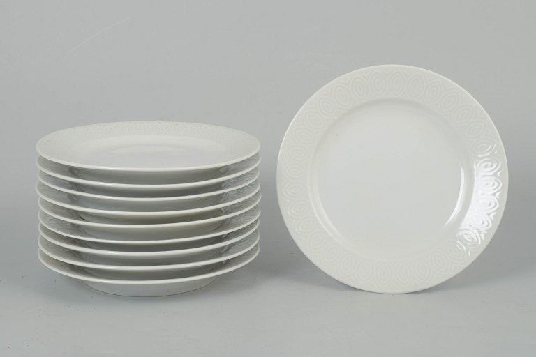 Axel Salto for Royal Copenhagen, Denmark. Porcelain set of ten salad plates with relief decoration.: Axel Salto for Royal Copenhagen, set of ten salad plates. Elegant set of ten porcelain salad plates with refined relief decoration and harmonious design language, produced for Royal Copenhagen. The de