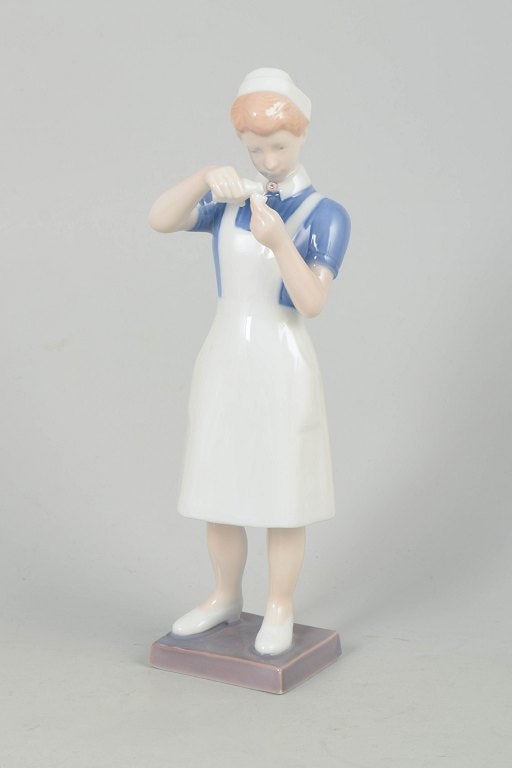 Bing & Grøndahll, Denmark. Porcelain nurse figurine. Approx. 1960s. (1 of 4)