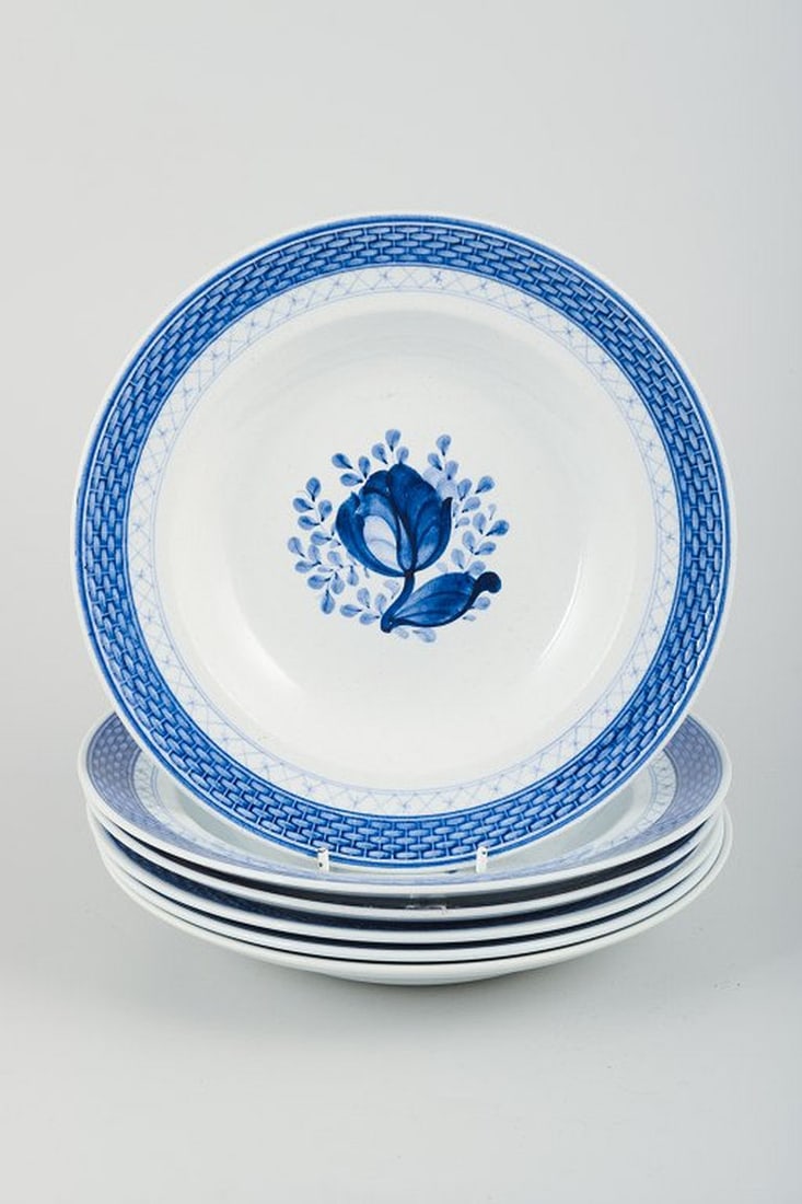 Christian Joachim for Aluminia, Denmark. Tranquebar. Six deep plates in light blue faience with dark: Six deep plates, model number 11/947. Aluminia, Tranquebar. Light blue faience with dark blue tulip and braided border, designed by Christian Joachim. Produced from 1914 to 1969, when production was