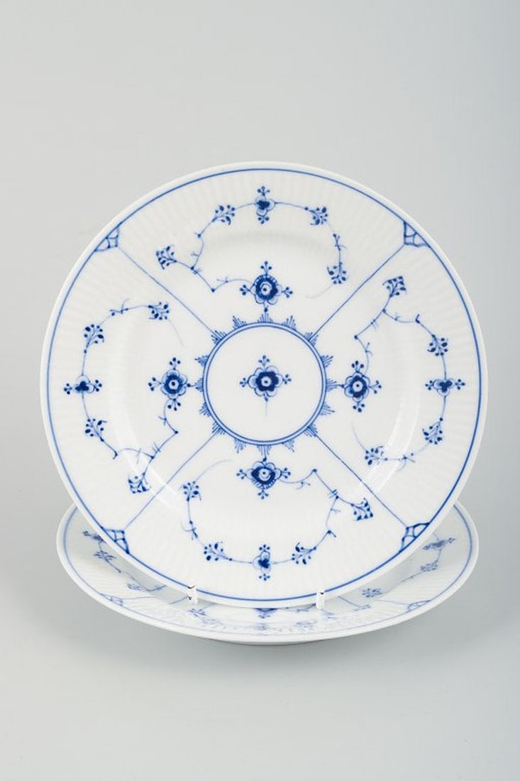 Royal Copenhagen Blue Fluted Plain. Two small porcelain luncheon plates. Circa 1930s.: Royal Copenhagen Blue Fluted Plain. Two small luncheon plates. Model number 1/179. Date: Circa 1930s. Stamped. Perfect condition. Third quality. Dimensions: D 19.2 cm. Blue Fluted is a classic porcela