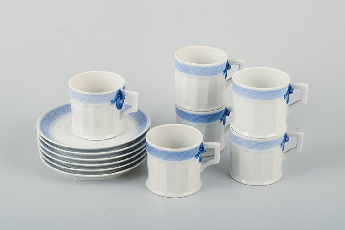 Arnold Krog for Royal Copenhagen Blue Fan. Six porcelain coffee cups with matching saucers. Circa: Royal Copenhagen Blue Fan, six coffee cups with matching saucers. Circa 1970s. Designed by Arnold Krog in 1909. Decoration number 1212/11548. Measurements: cup: H. 6 cm x D. 8 cm (including handle), s