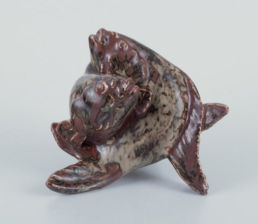 Hugo Liisberg for Saxbo, Denmark. Ceramic sculpture of two fish. Mid 1900s.: Hugo Liisberg for Saxbo, Denmark. Ceramic sculpture of two fish. Sung glaze. Mid 1900s. Signed HL. Perfect condition. Dimensions: W 15.0 cm. x H 13.0 cm.; Hugo Liisberg for Saxbo, Denmark. Ceramic scu