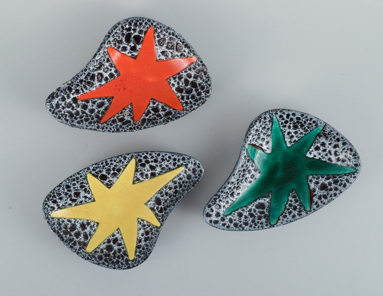 Vallauris, France, three ceramic bowls in brightly colored glazes in red, yellow and green on a dark - 2