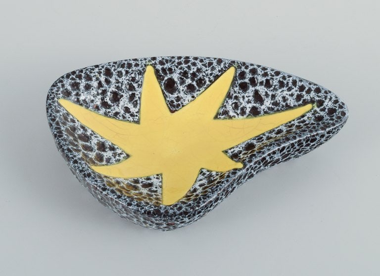 Vallauris, France, three ceramic bowls in brightly colored glazes in red, yellow and green on a dark - 3