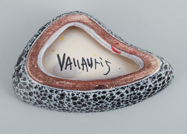 Vallauris, France, three ceramic bowls in brightly colored glazes in red, yellow and green on a dark - 8
