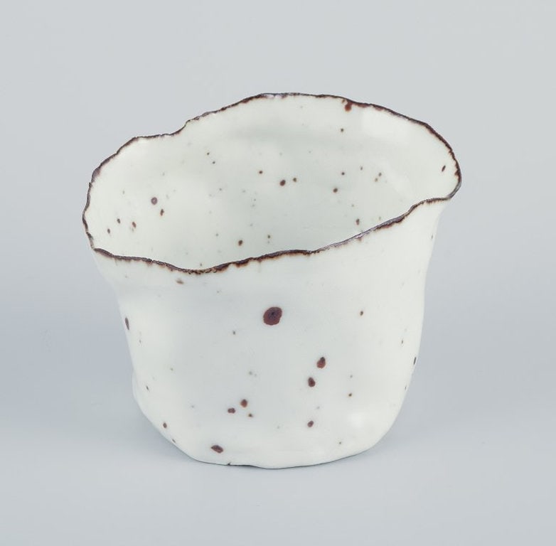 Royal Copenhagen. Unique ceramic vase. Ca. 1980s: Royal Copenhagen. Unique ceramic vase. Glossy glaze in shades of white with brown accents. Organic shape. Dating: Ca. 1980s Marked. First factory quality. In perfect condition. Unclear artist